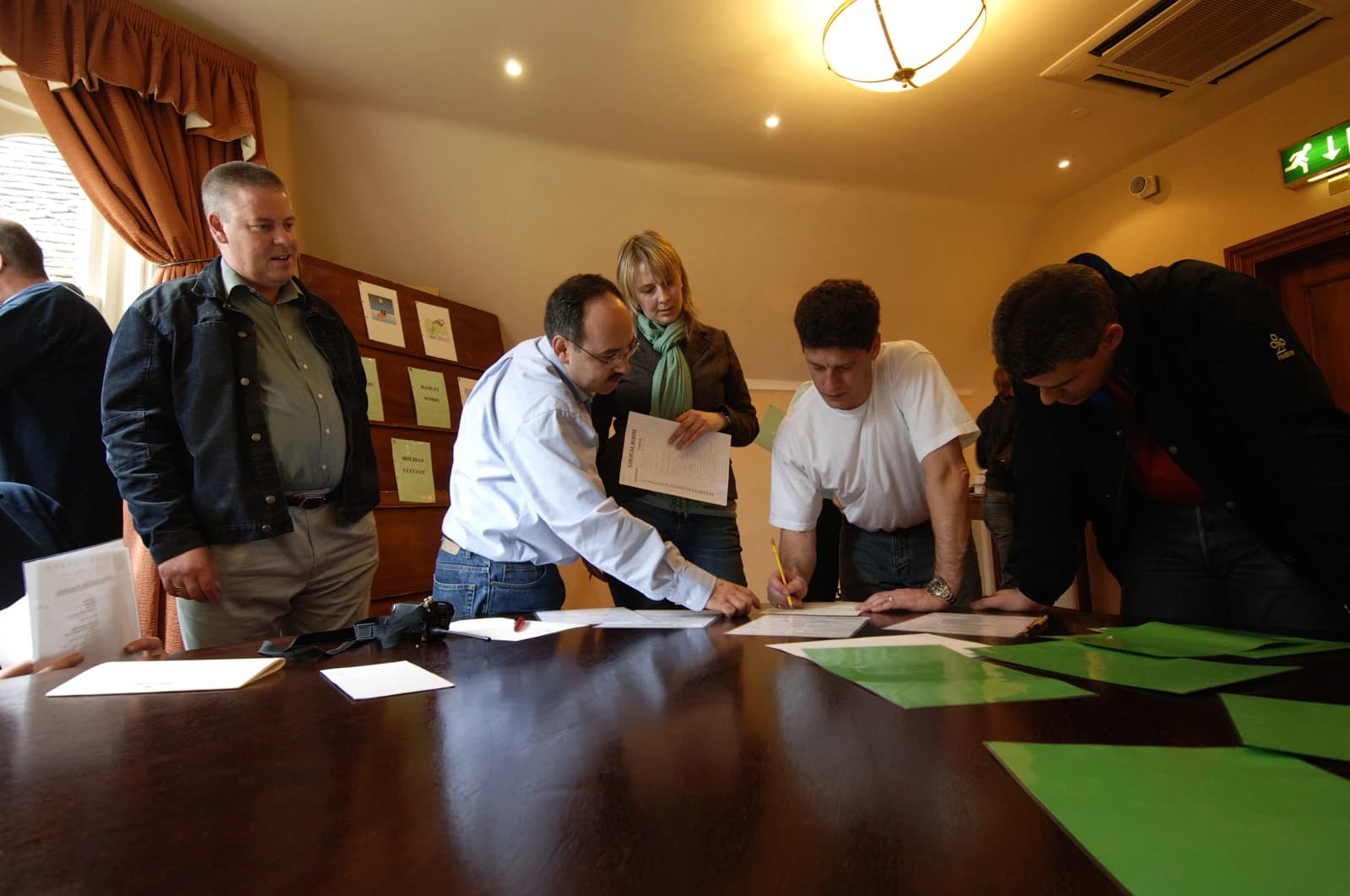 Team-building group working through a puzzle challenge