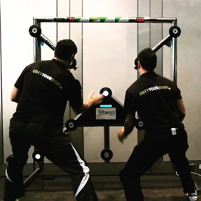 Two guests playing the BATAK light-reaction wall