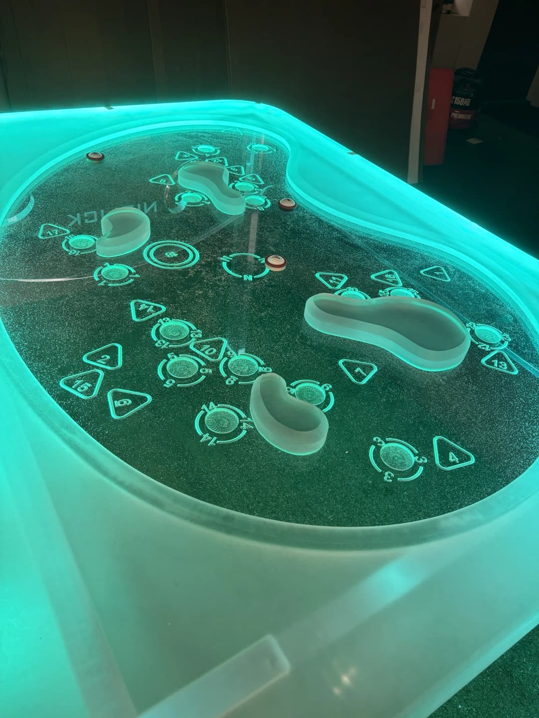 Niblick glow game table lit teal with playing pieces
