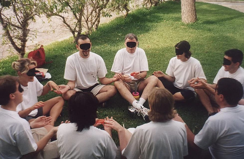 Team taking part in an outdoor team-building activity together